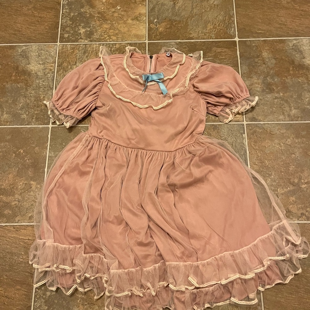 Cute babydoll dress in light pink with blue accent bow!